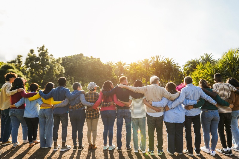 group of people hugging each others